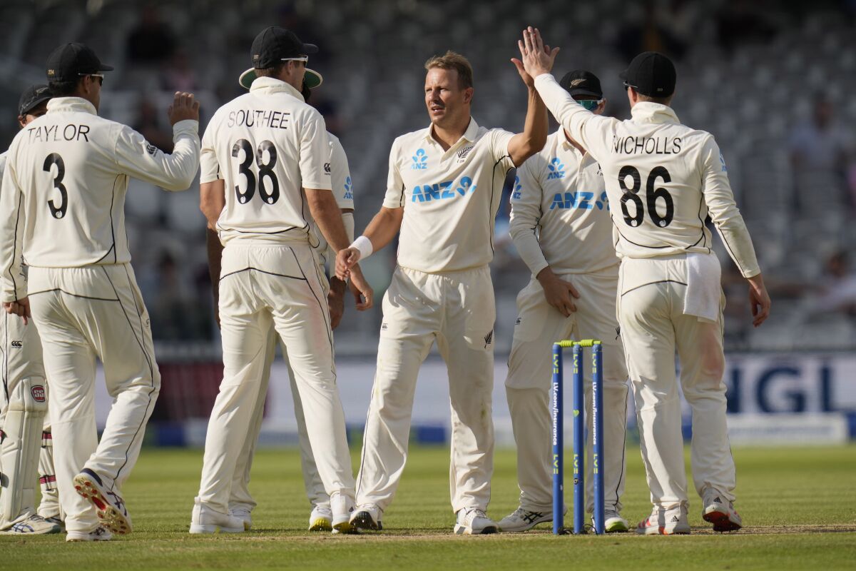 New Zealand's Neil Wagner celebrates taking the wicket of England's Joe Root during the fifth day of the Test match between England and New Zealand at Lord's cricket ground in London, Sunday, June 6, 2021. (AP Photo/Kirsty Wigglesworth)