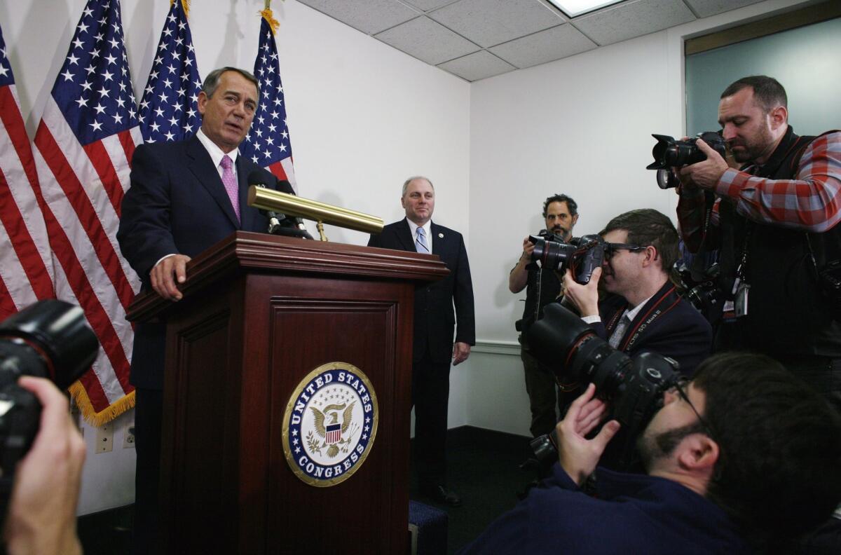 Outgoing House Speaker John Boehner of Ohio talks with reporters on Capitol Hill on Oct. 27.