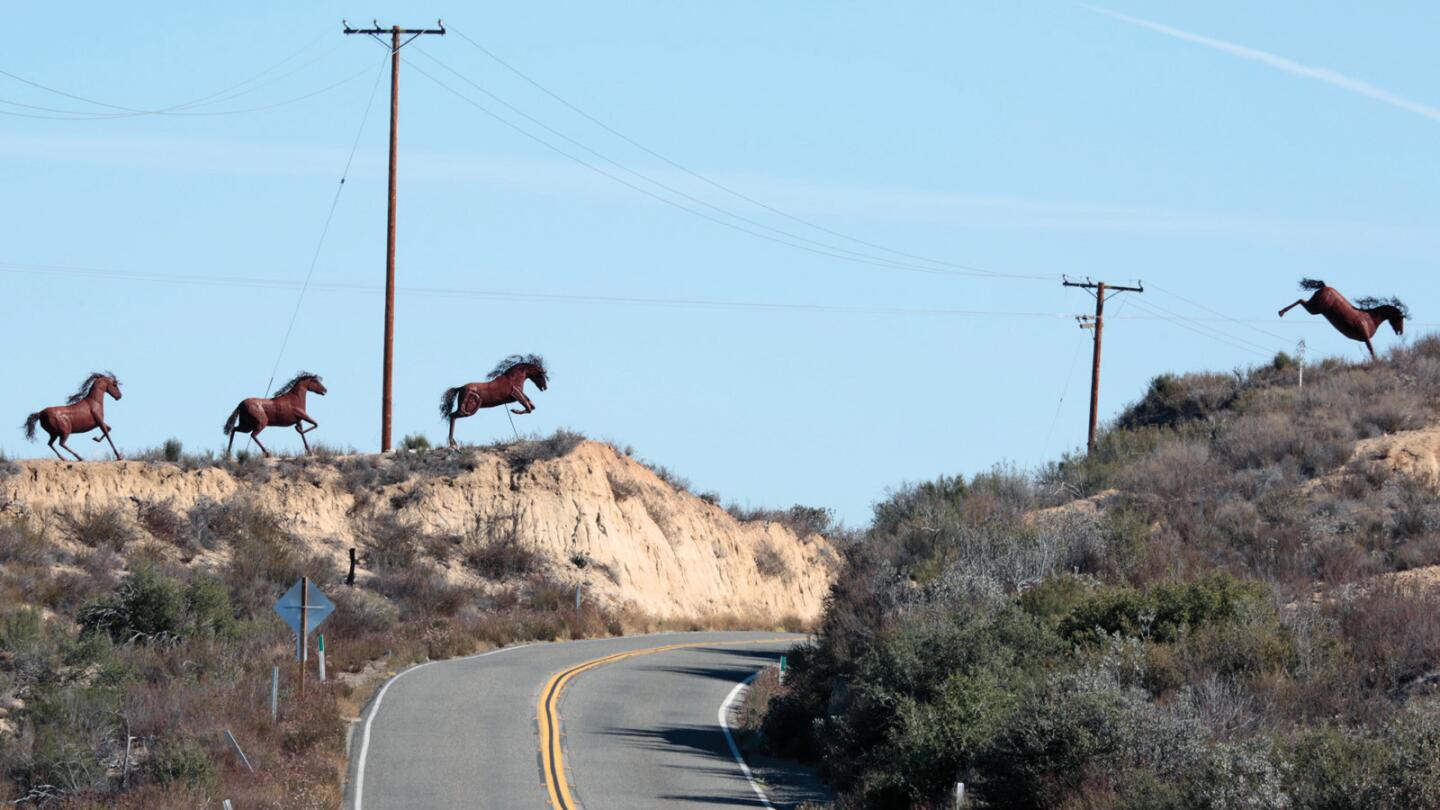 Mustangs of metal gallop and jump over California Highway 79 in Temecula. The sculptures are created by Ricardo Breceda whose studio is nearby.