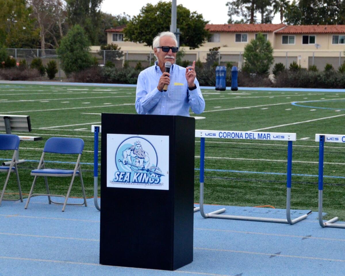Corona del Mar High School coach of 39 years, Bill Sumner, standing on the new track.