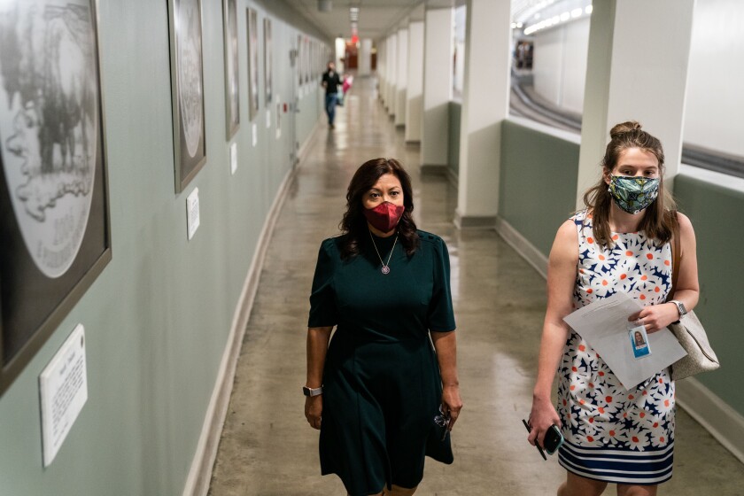 U.S. Rep. Norma Torres walks with staffer Leah Carey in the House Office Building subway.
