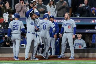 NEW YORK, NEW YORK - OCTOBER 16: The Los Angeles Dodgers celebrate a two-run home run.