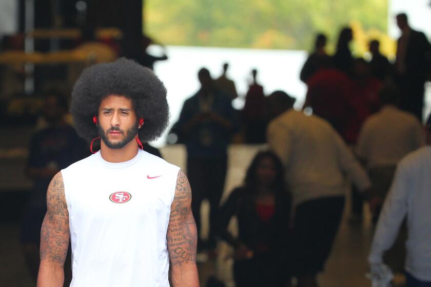 49ers quarterback Colin Kaepernick walks to the field before a game against the Buffalo Bills on Oct. 16.