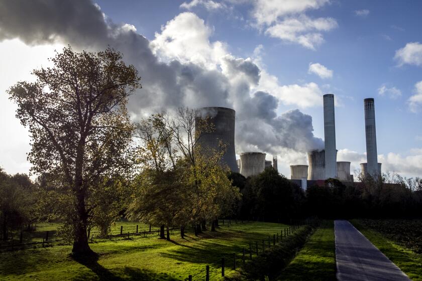 FILE - Steam rises from the coal-fired power plant Niederaussem, Germany, Wednesday, Nov. 2, 2022. A new accounting of carbon dioxide emissions finds that heat-trapping gas pollution from fossil fuels went up about 1% more than last year. (AP Photo/Michael Probst, File)