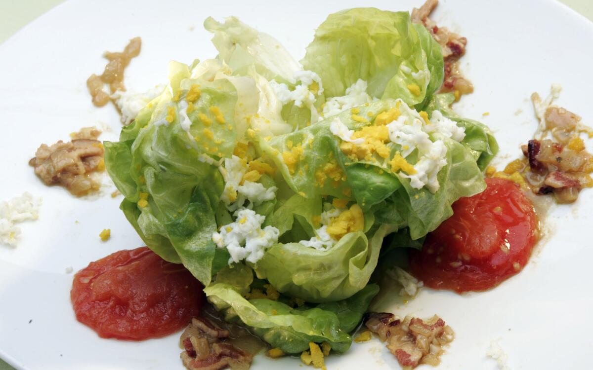 Butter lettuce salad with melted tomatoes and bacon-shallot vinaigrette