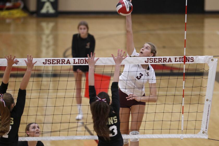 Laguna Beach High's Sophia Reavis spikes the ball against JSerra during the first set in a nonleague match on Wednesday.