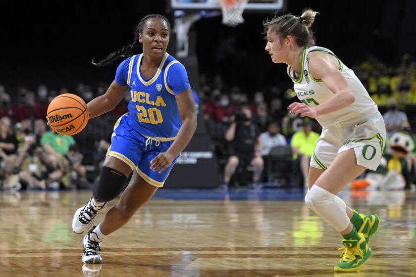 UCLA guard Charisma Osborne drives the ball against Oregon 