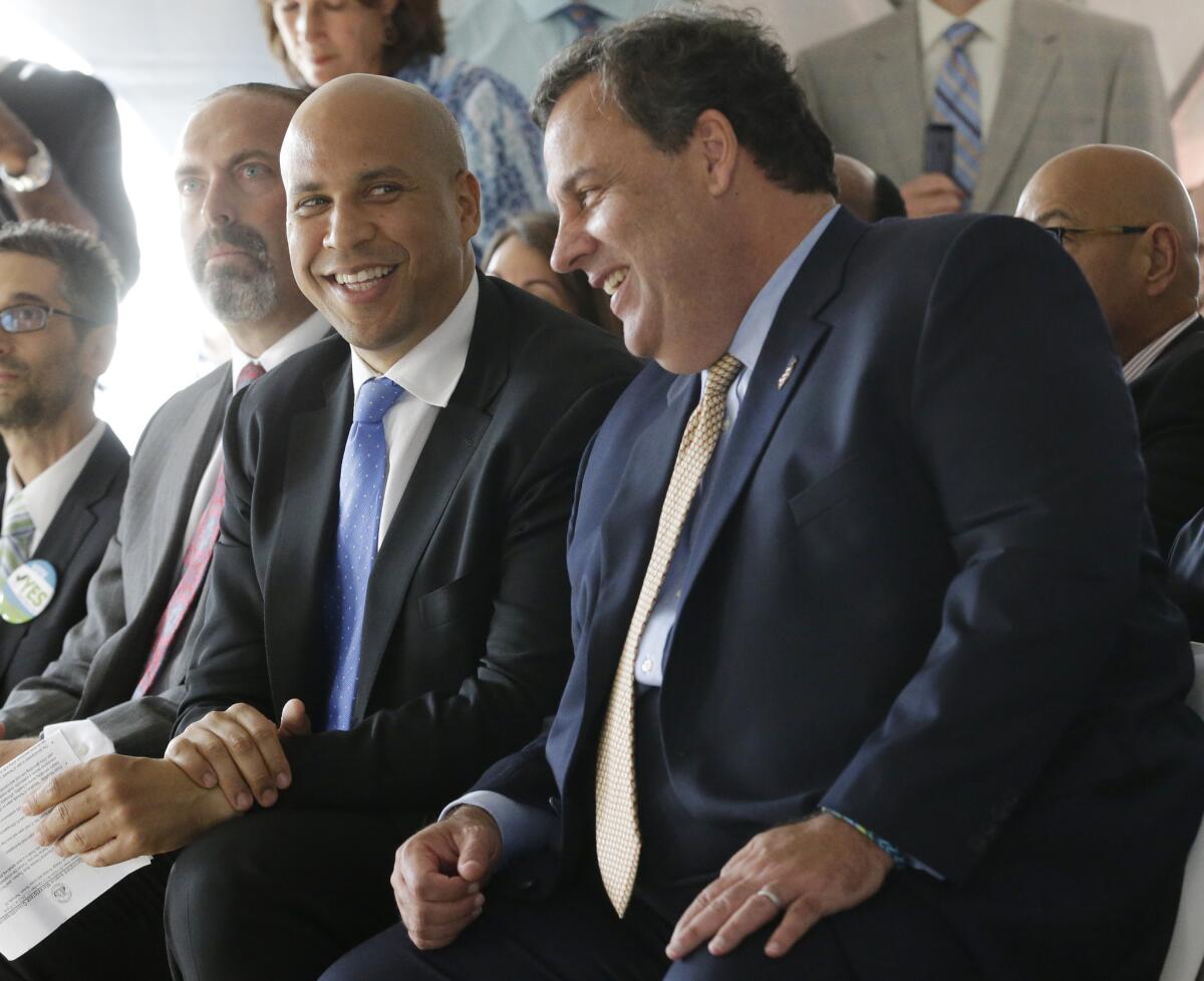 U.S. Sen. Cory Booker, left, and New Jersey Gov. Chris Christie are among the politicians whose style is critiqued by Tim Gunn for Politico.