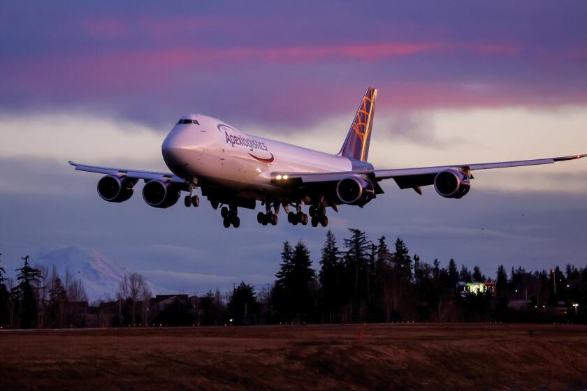 The final Boeing 747 lands at Paine Field following a test flight, Tuesday, Jan. 10, 2023, in Everett, Wash. Boeing bids farewell to an icon on Tuesday, Jan. 31, 2023, when it delivers the jumbo jet to cargo carrier Atlas Air. Since it debuted in 1969, the 747 has served as a cargo plane, a commercial aircraft capable of carrying nearly 500 passengers, and the Air Force One presidential aircraft, but it has been rendered obsolete by more profitable and fuel-efficient models. (Jennifer Buchanan/The Seattle Times via AP)