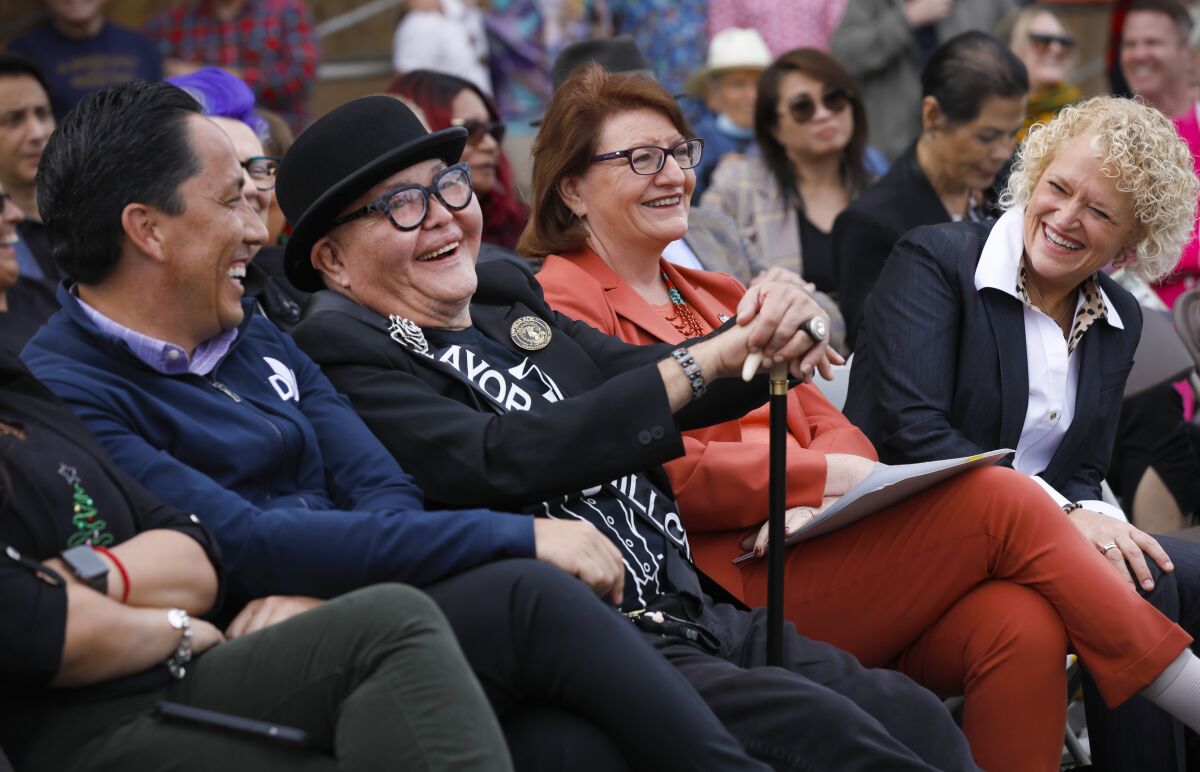 People sit together and smile.