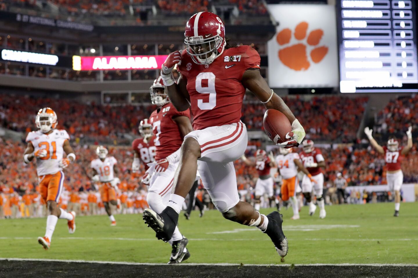 Alabama running back Bo Scarbrough crosses the goal line for a 37-yard touchdown run against Clemson during the second quarter.