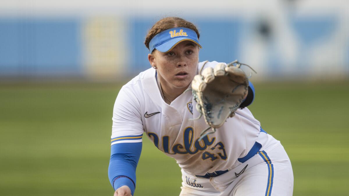 UCLA third baseman Megan Grant catches the ball during an NCAA softball game.