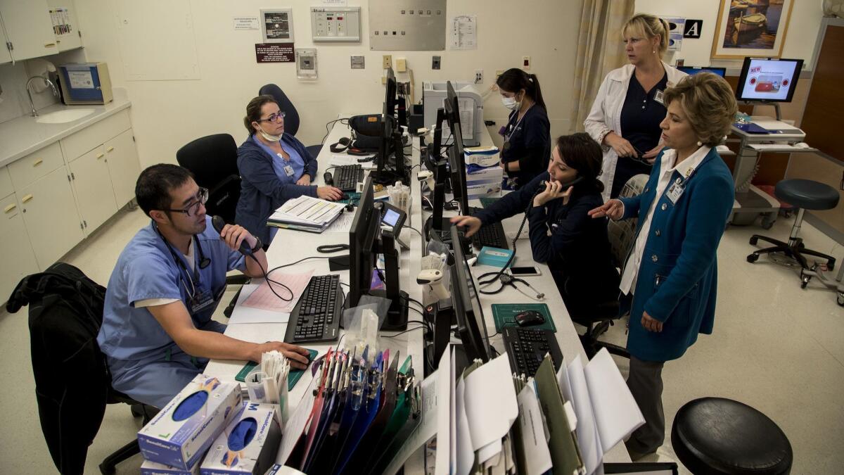 Nurses and doctors work at Torrance Memorial Medical Center this year. The state's education and health services sector grew by 18,700 jobs in August.