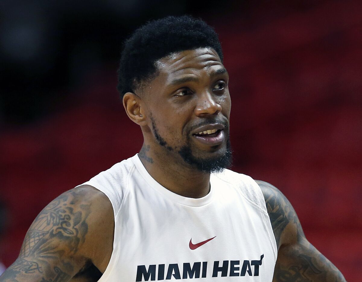 FILE - In this March 1, 2018, file photo, Miami Heat forward Udonis Haslem chats before the start of an NBA basketball game against the Los Angeles Lakers, in Miami. Haslem is officially back with the Miami Heat. Haslem signed another contract — the 10th of his career — with the Heat on Sunday, Aug. 15, 2021, assuring that he will return for a 19th season with Miami. It is a one-year deal worth about $2.8 million. (AP Photo/Wilfredo Lee, File)