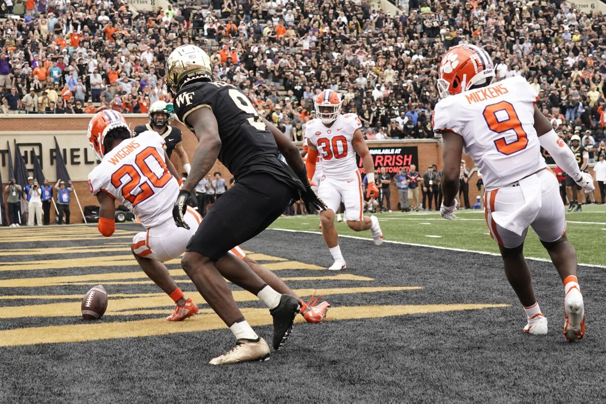 Clemson cornerback Nate Wiggins (20) knocks down a pass intended for Wake Forest's A.T. Perry (9) on Sept. 24, 2022.