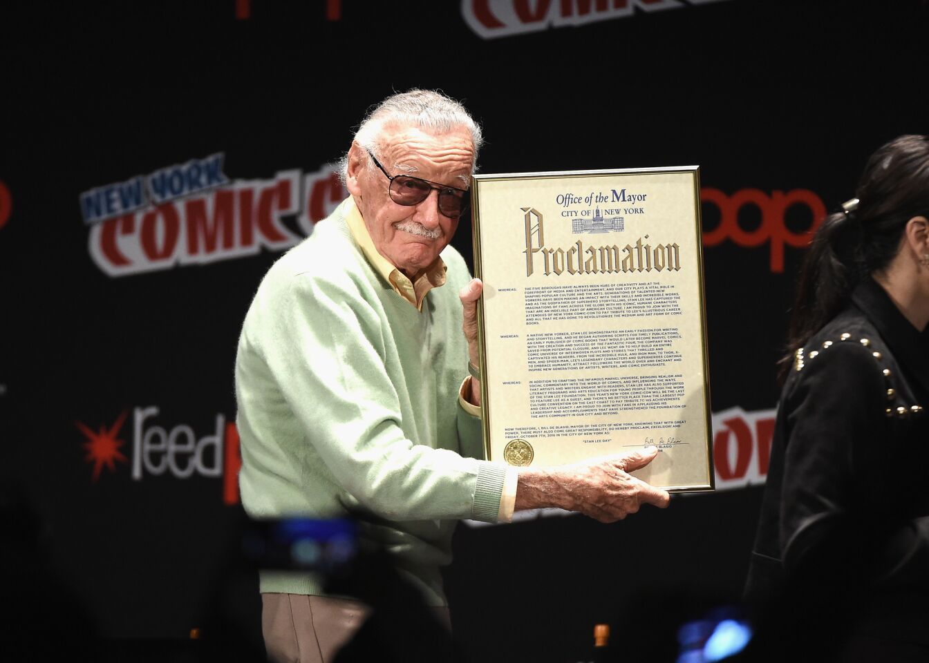 Stan Lee holds a proclamation for Stan Lee Day —Oct. 7, 2016 — by the city of New York onstage at Madison Square Garden.