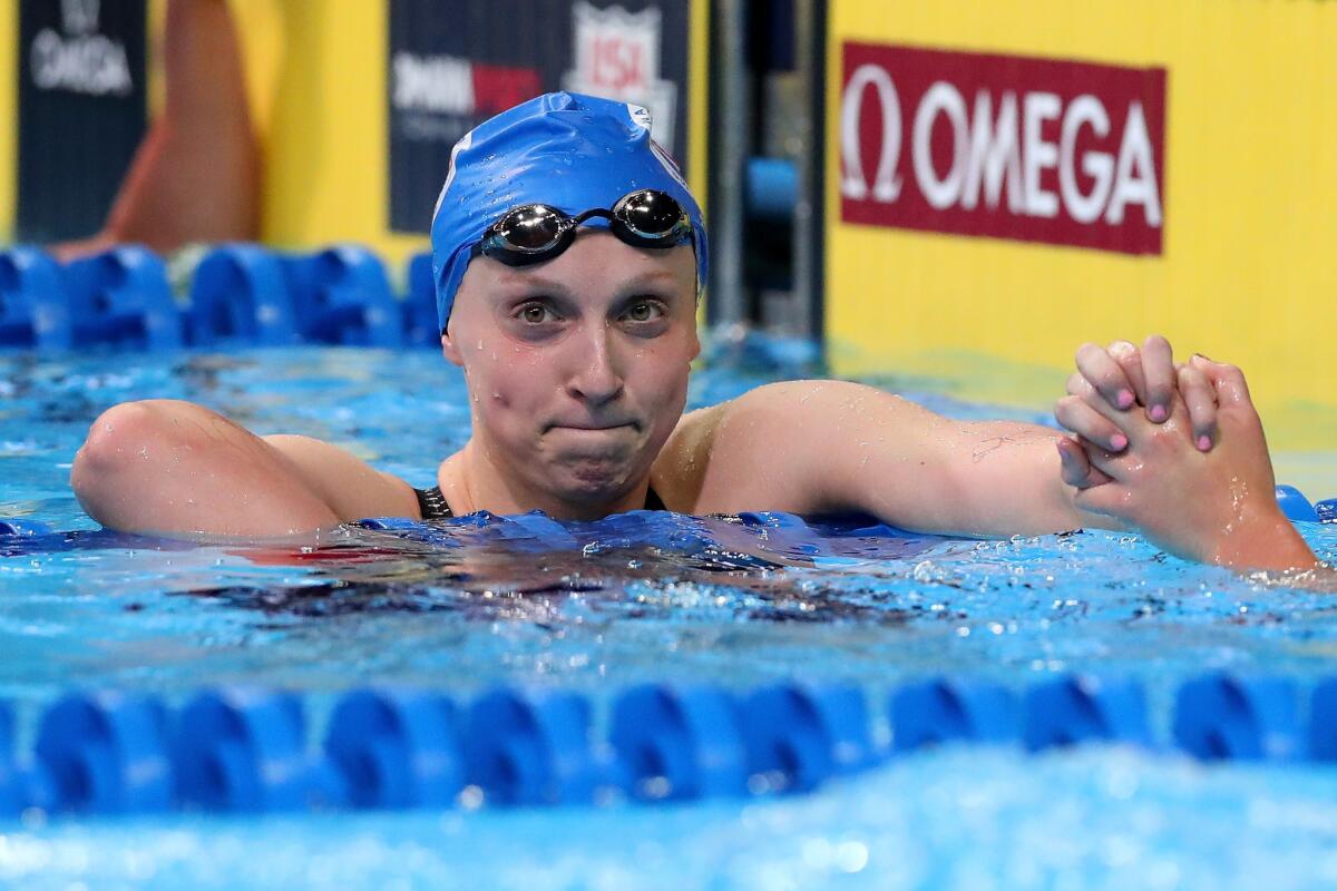 Katie Ledecky celebrates after finishing first in the final heat for the women's 800 meter freestyle event during the 2016 Olympic Team Swimming Trials in Omaha.