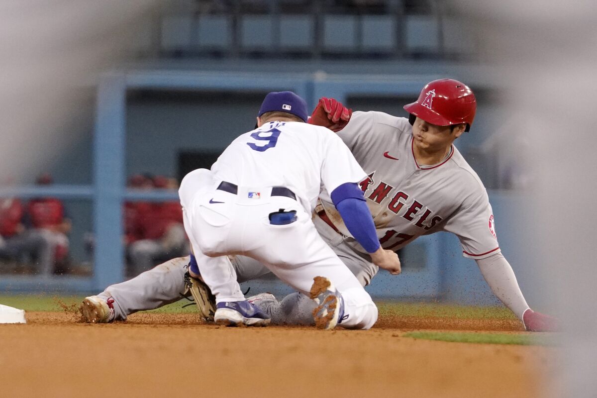 Angels' Shohei Ohtani is tagged out at second by Dodgers second baseman Gavin Lux.