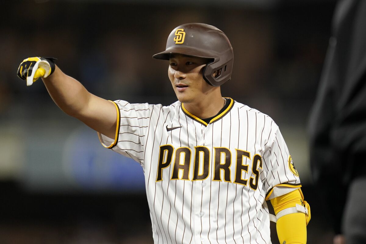 San Diego Padres' Ha-Seong Kim reacts after hitting an RBI-single during the fourth inning of a baseball game against the Cincinnati Reds, Monday, April 18, 2022, in San Diego. (AP Photo/Gregory Bull)
