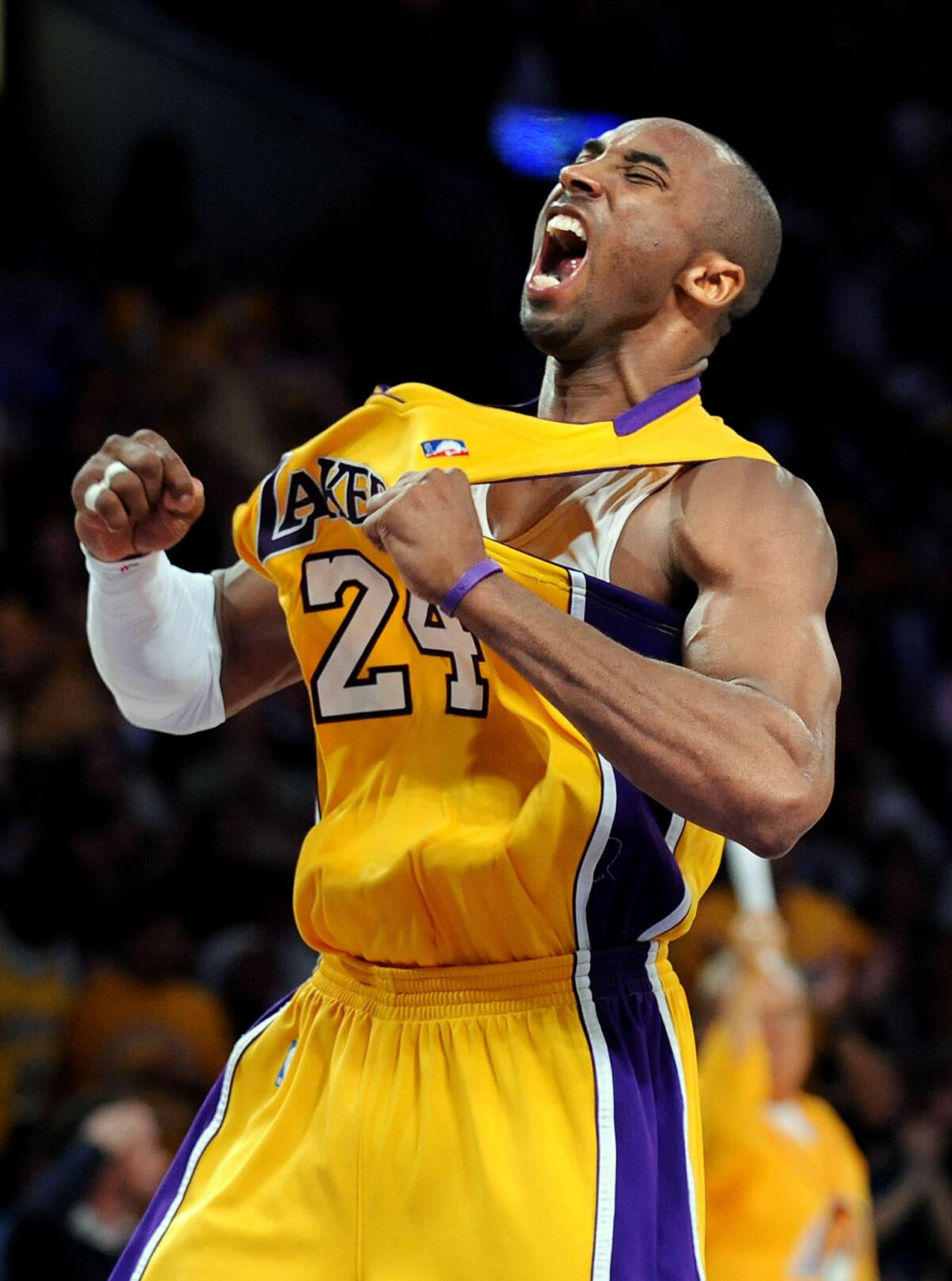 Lakers' Kobe Bryant celebrates after making a three–pointer against the Nuggets