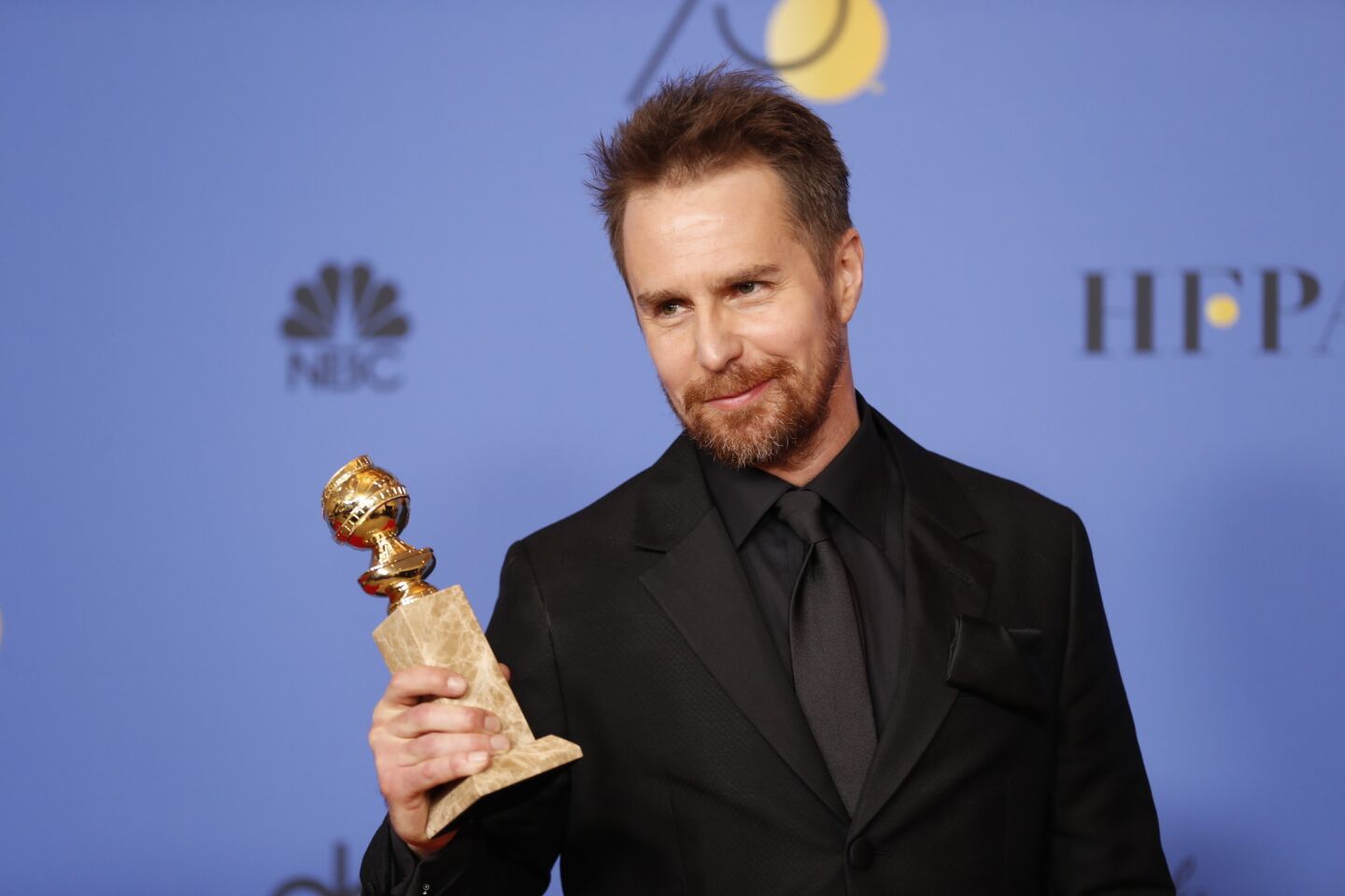 Sam Rockwell displays his award for supporting actor in a film for "Three Billboards Outside Hibbing, Missouri."