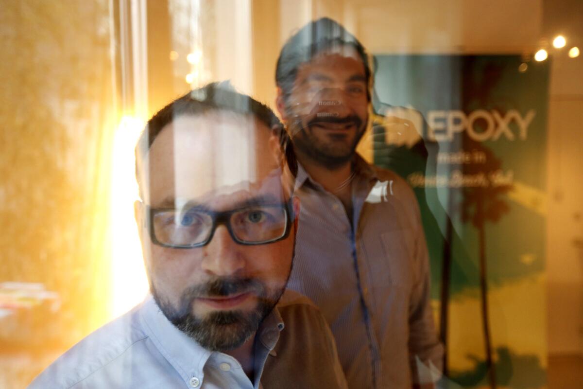 Epoxy co-founders Juan Bruce, left, and Jason Ahmad at the company's headquarters in Venice in January. (Genaro Molina / Los Angeles Times)