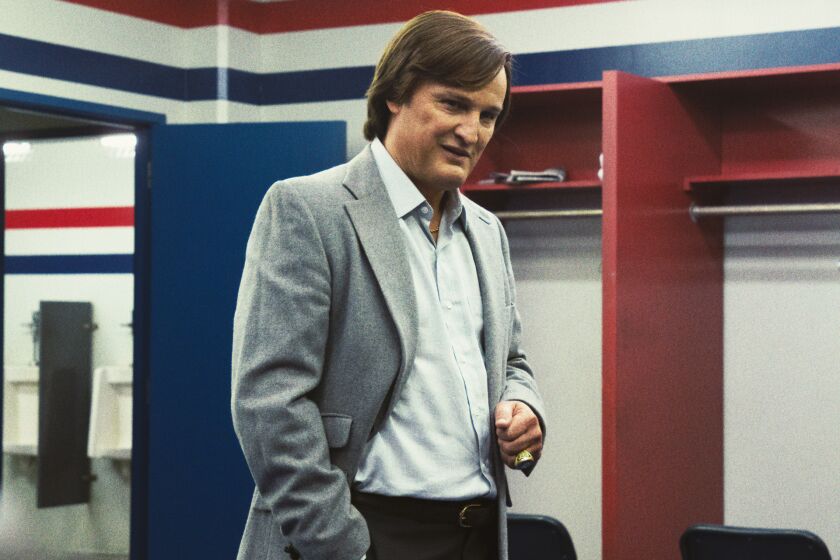A man stands in a locker room