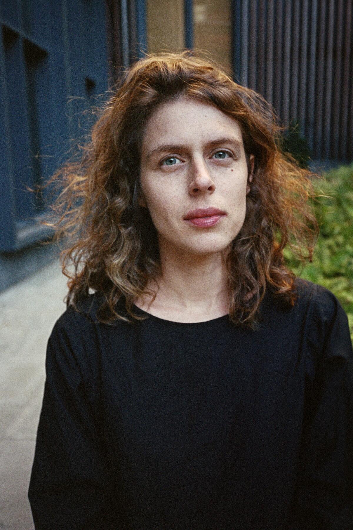 Headshot of a woman in a sweater