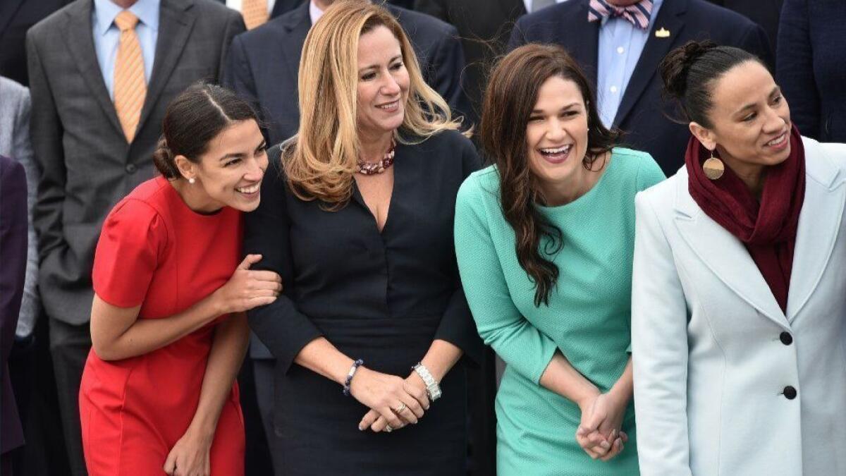 Reps. Alexandria Ocasio-Cortez (D-N.Y.), Debbie Mucarsel-Powell (D-Fla.), Abby Finkenauer (D-Iowa) and Sharice Davids (D-Kan.) pose for the 116th Congress members-elect group photo on the East Front Plaza of the U.S. Capitol in November 2018.