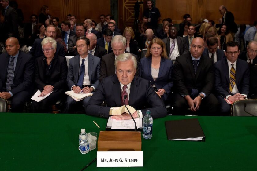 FILE - In this Tuesday, Sept. 20, 2016, file photo, Wells Fargo CEO John Stumpf prepares to testify on Capitol Hill in Washington, before the Senate Banking Committee. In the results of an investigation released Monday, April 10, 2017, Wells Fargo's board of directors has blamed the bank's most senior management for creating an "aggressive sales culture" at Wells that eventually led to the bank's scandal over millions of unauthorized accounts. The results of the investigation, conducted by the law firm Shearman & Sterling, also called for millions of dollars in compensation to be clawed back from former CEO Stumpf and community bank executive Carrie Tolstedt. (AP Photo/Susan Walsh, File)