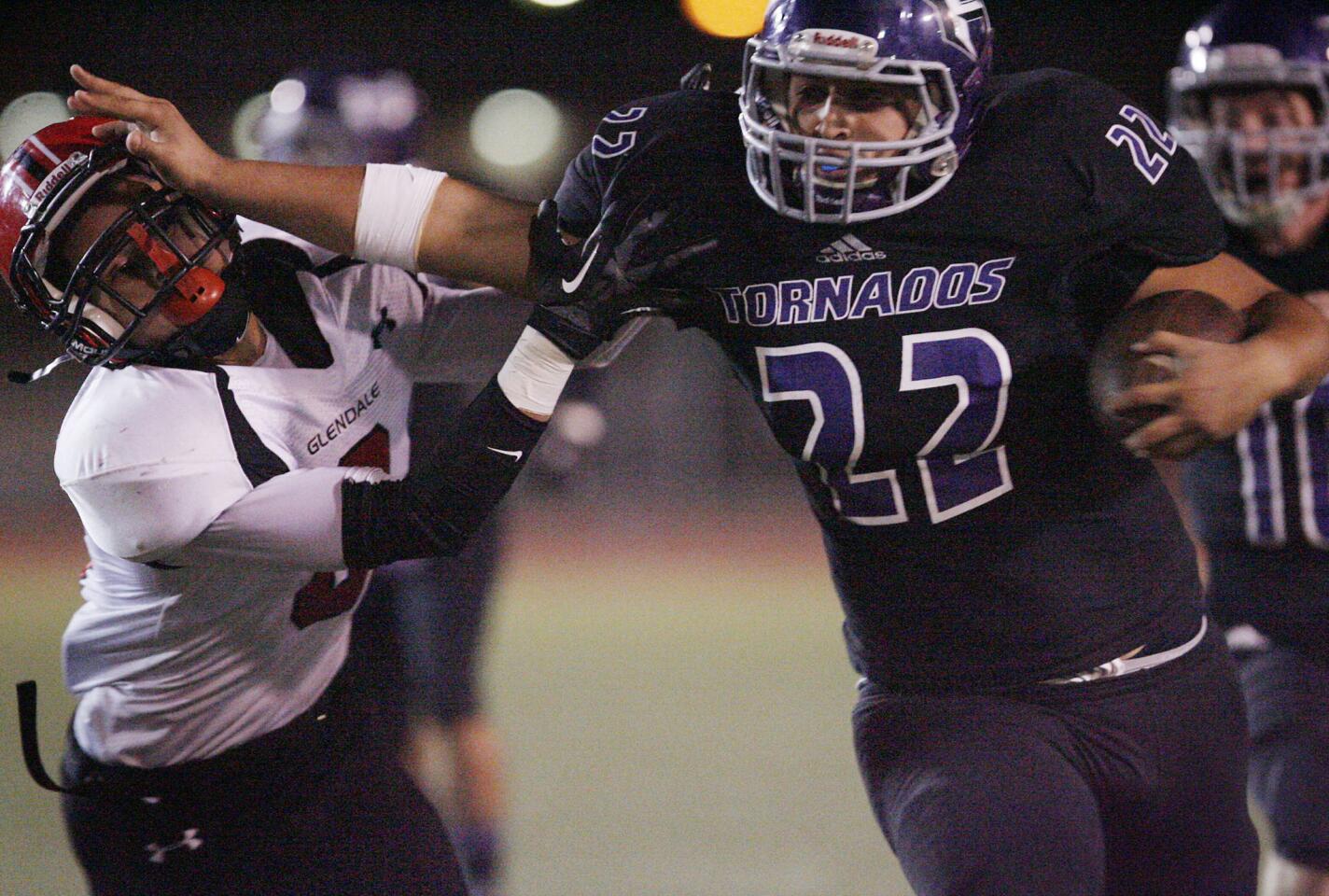 Glendale's Martin Marin, left, tries to tackle Hoover's Jesse Pina during a game at Glendale High School on Friday, November 2, 2012.