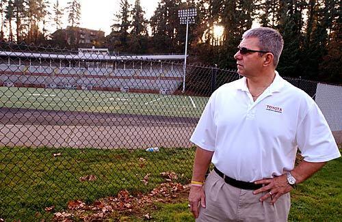 Bill Claridge talks about his son Travis during a visit to Kiggins Bowl in Vancouver, Wash. His son, who played for the Fort Vancouver Trappers, then USC and in the NFL for Atlanta and Carolina, died a month short of his 28th birthday.