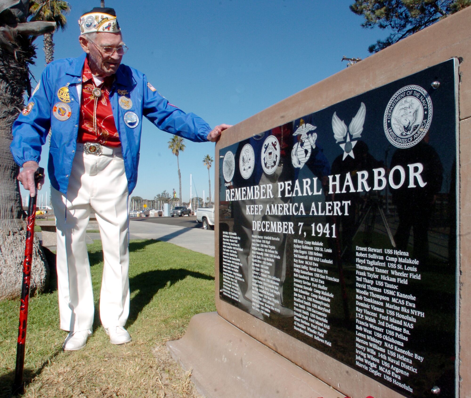 Pearl Harbor Survivor Ted Roosvall, age 86, of San Marcos, looks at rememberance plaque