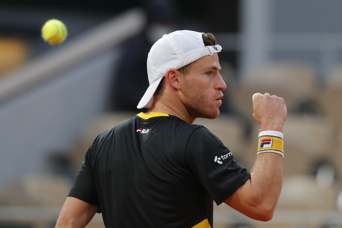 Diego Schwartzman clenches his fist after scoring a point against Dominic Thiem.