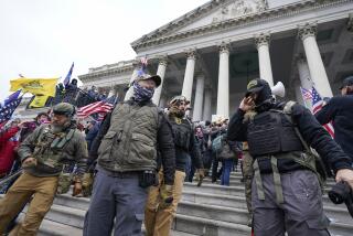 FILE - Members of the Oath Keepers extremist group stand on the East Front of the U.S. Capitol on Jan. 6, 2021, in Washington. David Moerschel, a 45-year-old neurophysiologist from Punta Gorda, Fla., who stormed the U.S. Capitol with other members of the far-right Oath Keepers group, was sentenced Friday to three years in prison for seditious conspiracy and other charges, the latest in a historic string of sentences in the Jan. 6. 2021 attack. (AP Photo/Manuel Balce Ceneta, File)