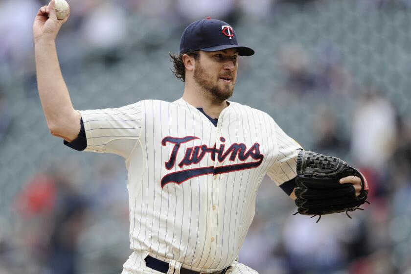 Phil Hughes of the Minnesota Twins delivers a pitch against the Arizona Diamondbacks during the first inning Wednesday.