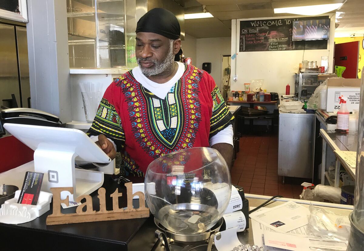 David Simmons, 48, the owner of a soul food restaurant in Jonesboro, Ga., does not think it is is safe to open his restaurant to dine-in customers. After making $23.97 one day last week, he is struggling to pay rent.