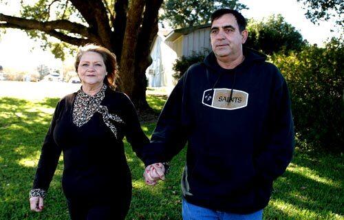 Leontine and Dean Verrett walk toward the bayou near their home in Jeanerette, La. They married two years after two Louisiana State Penitentiary inmates were convicted in the murder of her first husband.