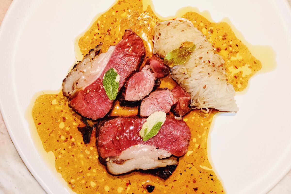 Firstborn's cumin lamb saddle with Sichuan jus and shredded potato.