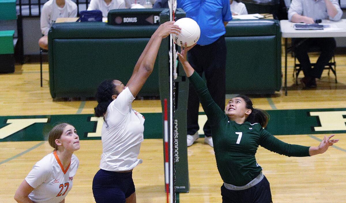 Providence's Jennifer Tolentino and Polytechnic's Laila Ward battle at the top of the net for the ball in a Prep League girls' volleyball match at Providence High School on Tuesday, September 17, 2019.