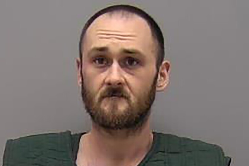 This Jan. 5, 2022, photo provided by the Sangamon County Sheriff's Office in Springfield, Ill., shows Benjamin H. Reed. Reed is charged with first degree murder and aggravated battery with a deadly weapon in the stabbing death Tuesday, Jan. 4, 2022, of DCFS child-welfare worker Diedre Silas, 36. (Sangamon County Sheriff's Office via AP)