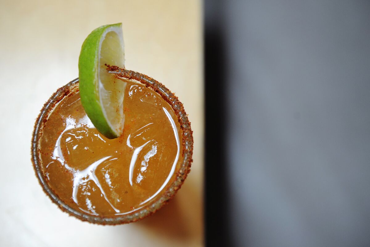 The classic michelada at Loteria Grill consists of lime juice, Worcestershire sauce, Maggi, Tapatio, celery salt and a bottle of Dos Equis.