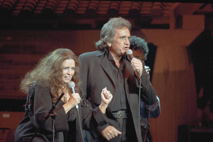 Married country stars June Carter Cash and Johnny Cash.