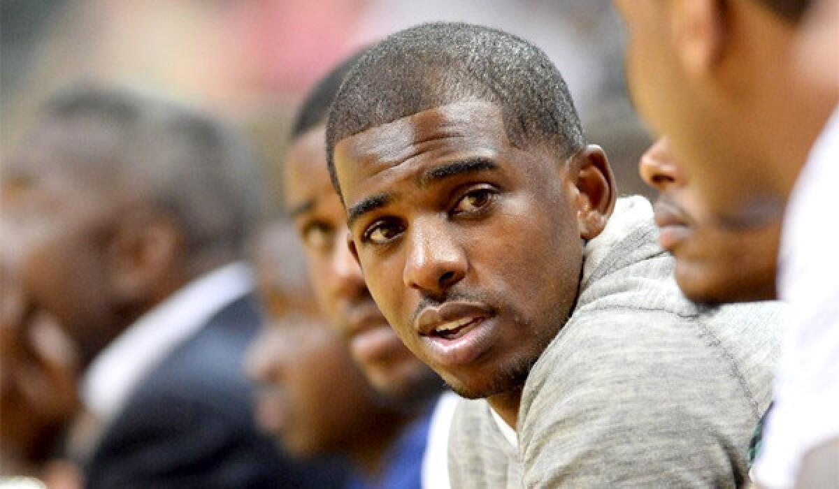 Clippers guard Chris Paul, above, succeeds former Lakers guard Derek Fisher as NBA players' association president.