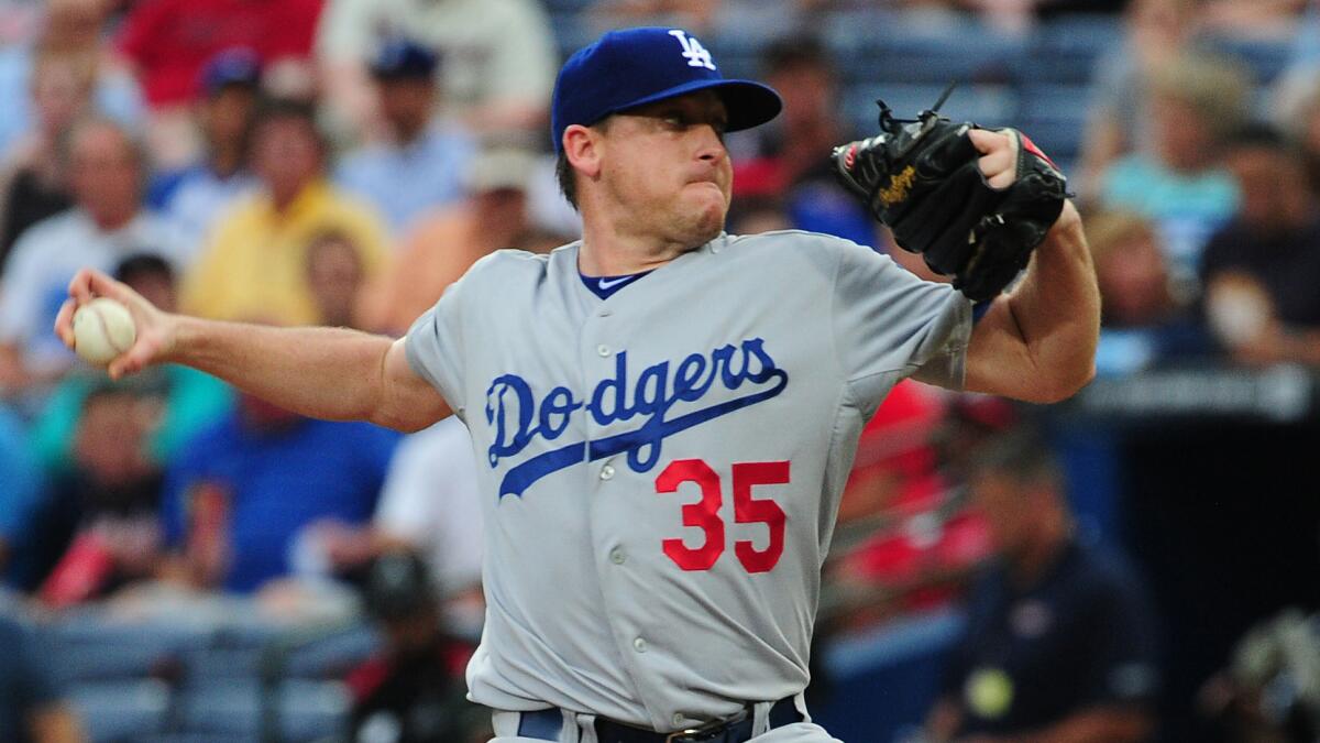 Dodgers starter Kevin Correia delivers a pitch during the first inning of Monday's game against the Atlanta Braves.