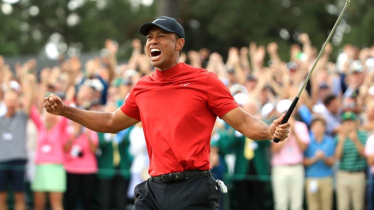 Tiger Woods celebrates after winning the Masters on Sunday.