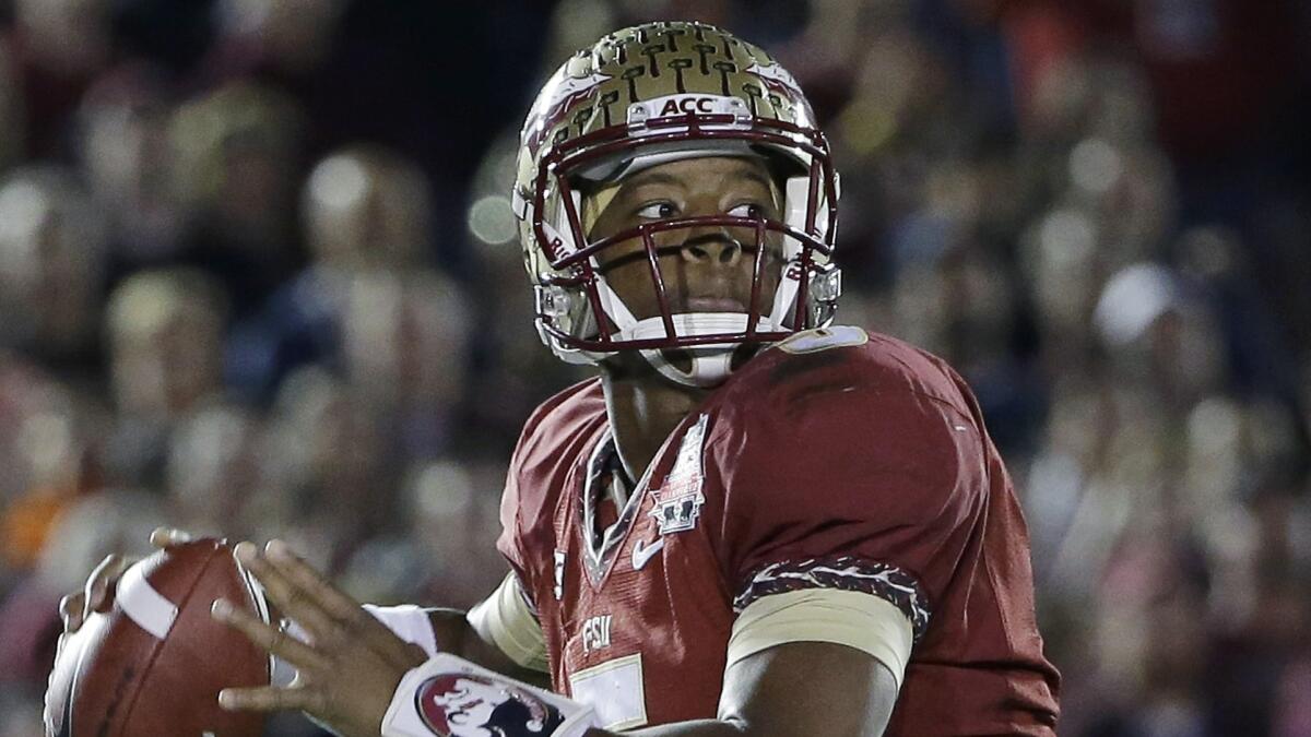 Florida State quarterback Jameis Winston throws during last year's BCS national championship win over Auburn. The Seminoles are ranked No. 1 in the Associated Press pre-season poll.
