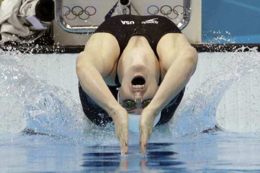 Missy Franklin starts in a women's 100-meter backstroke swimming heat.