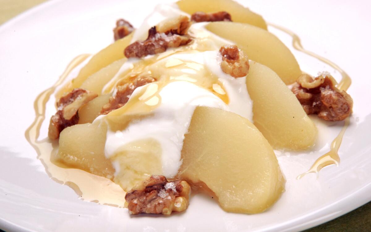 Honey-poached pear with Greek yogurt and toasted walnuts