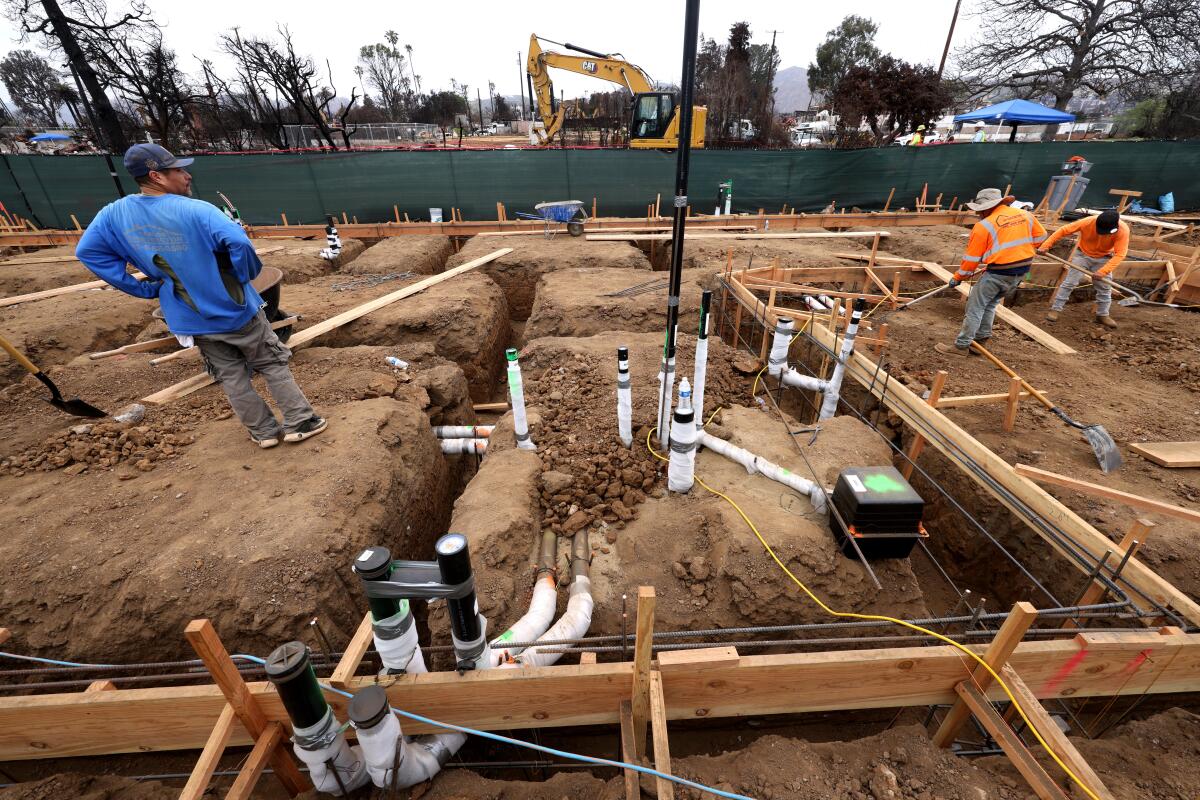 People work in a construction site.